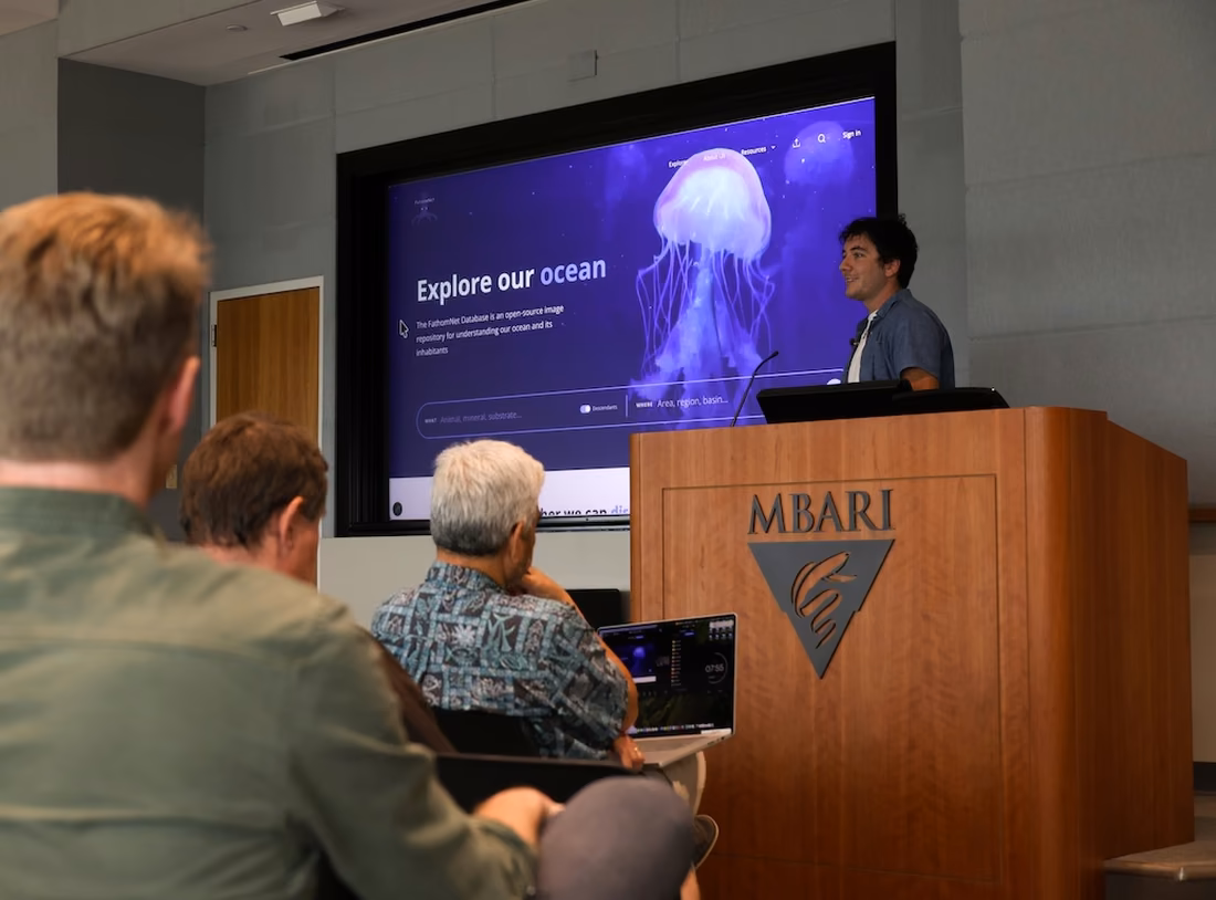 Presenting the summer internship work from the podium at MBARI, with the FathomNet database on screen